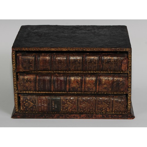 1674 - A 19th century novelty disguise volume library desk top collector’s chest, the drawers composed as a... 