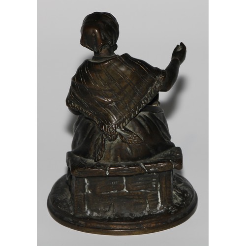 1559 - A 19th century dark patinated bronze novelty so-to-bed or table vesta, as a match girl, the box on h... 