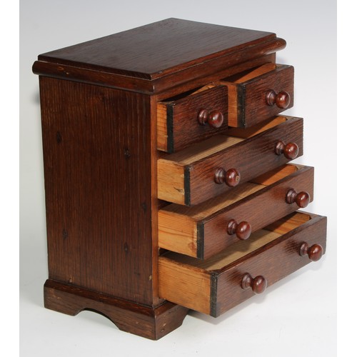 1926 - An Edwardian oak miniature chest, rectangular top above two short and three long graduated drawers, ... 