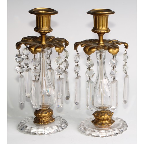 1816 - A pair of 19th century gilt bronze and clear glass candle lustres, each with fluted campana sconce a... 