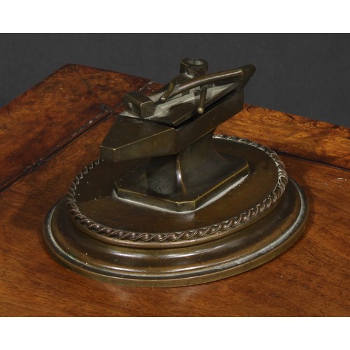 1556 - A 19th century bronze novelty table vesta, as a blacksmith's anvil, the hinged cover with hammer and... 