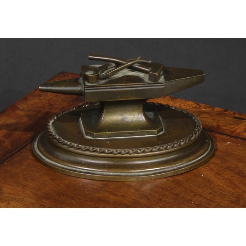 1556 - A 19th century bronze novelty table vesta, as a blacksmith's anvil, the hinged cover with hammer and... 