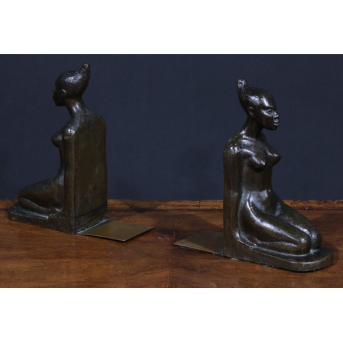 1823 - A pair of Art Deco brown patinated bronze bookends, probably Austrian, each cast as a kneeling exoti... 