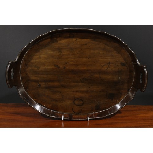 1554 - A 19th century brass bound coopered mahogany two-handled tray, wavy gallery with pierced carrying ha... 