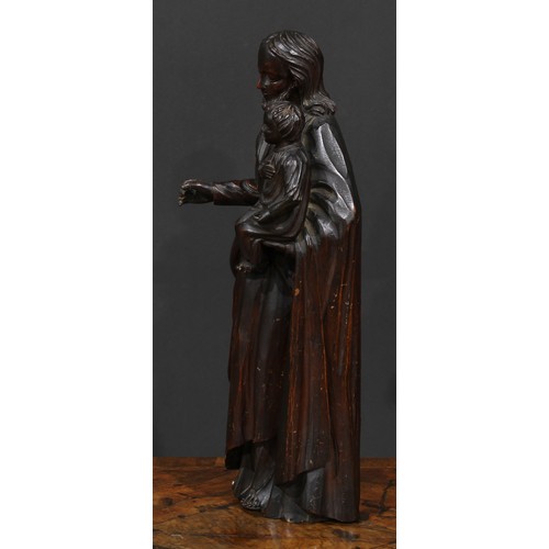 2631 - An 18th century Continental softwood figure, carved as Christ holding an infant, 50cm high, c.1700-1... 