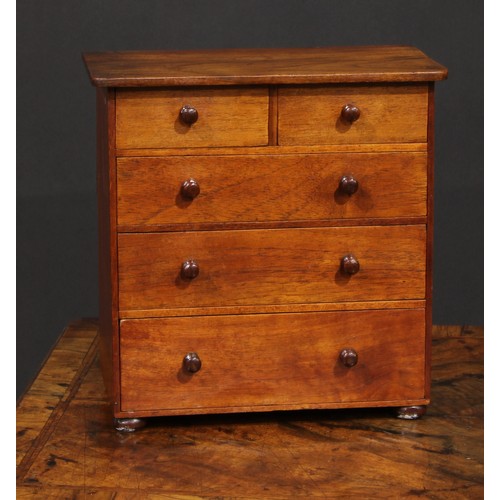 2723 - Miniature Furniture - a chest of two short and three long graduated drawers, oversailing top, turned... 