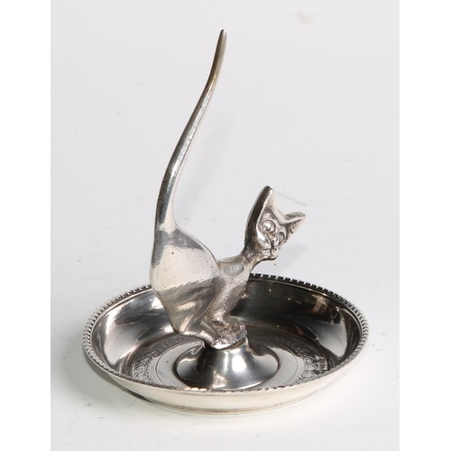 879 - A Continental silver novelty ring tree, as a stylised cat, the dished base bright-cut engraved, 9cm ... 