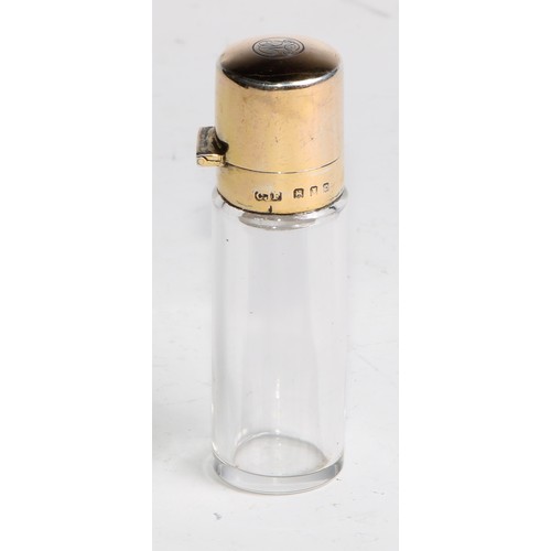 980 - A George V silver-gilt cylindrical scent bottle, hinged cover enclosing a stopper, 7.5cm high, Charl... 