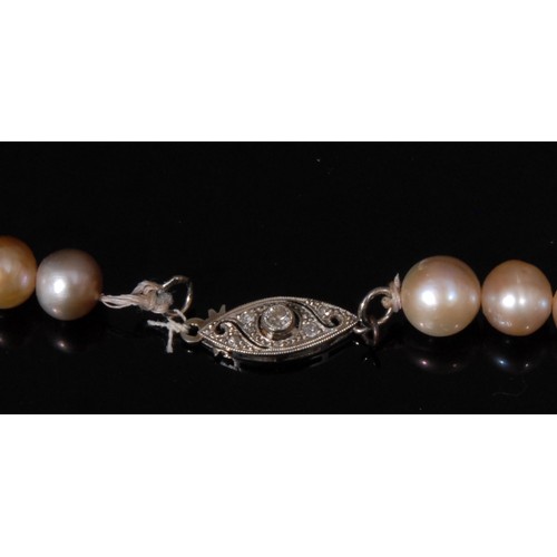 1506 - An early 20th century pearl necklace, the strand of fifty five pearls approximately 7mm to 6mm in di... 