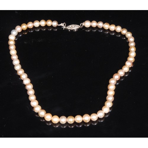 1506 - An early 20th century pearl necklace, the strand of fifty five pearls approximately 7mm to 6mm in di... 