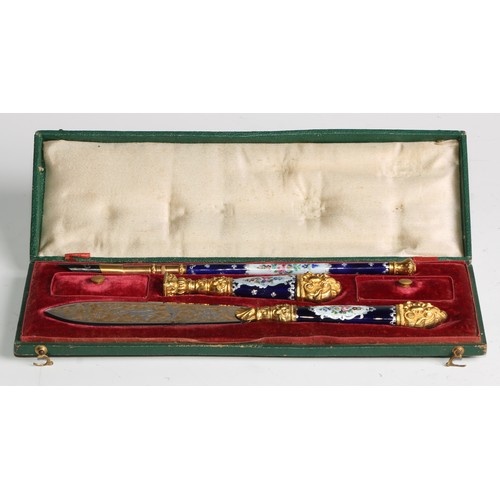 2135 - A 19th century French enamel and gilt metal writing suite, comprising a desk seal, letter knife and ... 