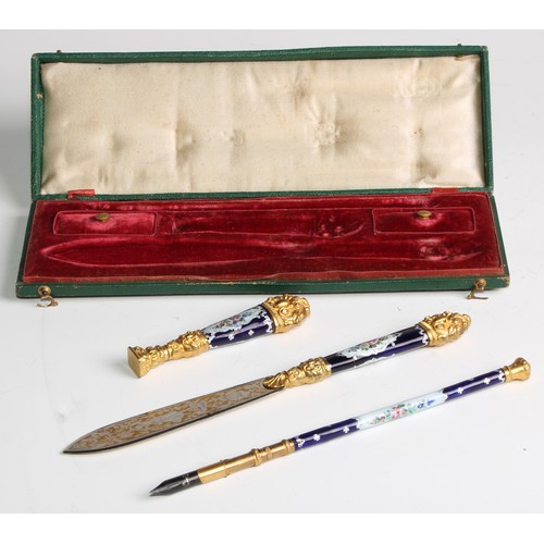 2135 - A 19th century French enamel and gilt metal writing suite, comprising a desk seal, letter knife and ... 