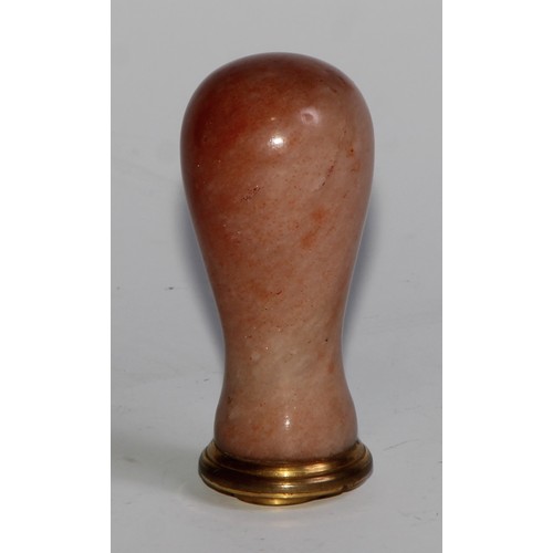 2143 - A 19th century polished alabaster desk seal, blood agate matrix, 7cm long; a silver-gilt coloured me... 