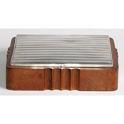 990 - A large Continental Art Deco silver and walnut shaped rectangular cigar box, hinged engine turned co... 