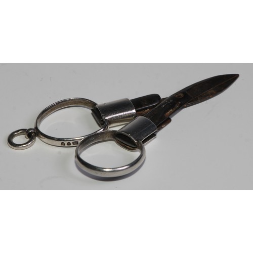 1036 - A pair of Victorian silver patent travelling scissors, folding for the pocket or chatelaine, 9cm lon... 