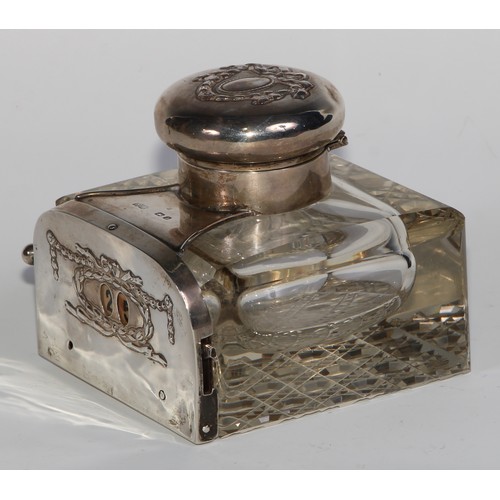 1191 - An unusual Edwardian silver combination inkwell and mechanical perpetual desk calendar, hinged cover... 