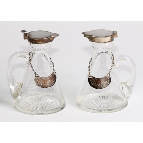 1019 - A pair of Edwardian silver mounted whisky noggins, hinged covers, loop handles, star-cut bases, 10.5... 