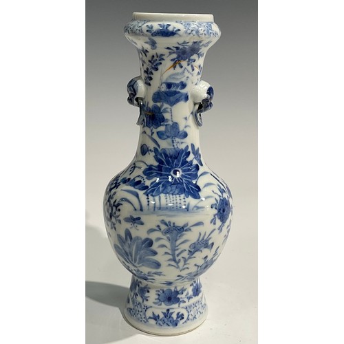 354 - A Chinese baluster vase, painted in tones of underglaze blue with birds, flowers and foliage, moulde... 