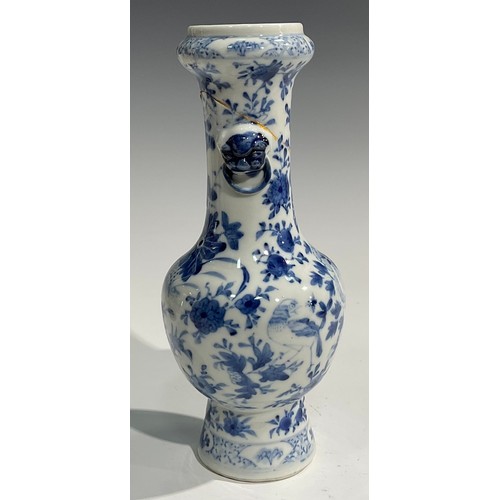 354 - A Chinese baluster vase, painted in tones of underglaze blue with birds, flowers and foliage, moulde... 