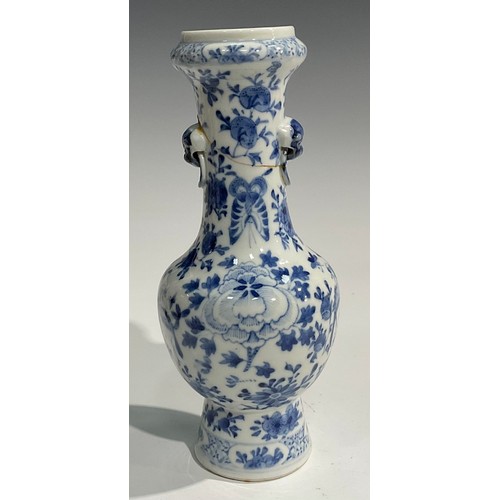 354 - A Chinese baluster vase, painted in tones of underglaze blue with birds, flowers and foliage, moulde... 