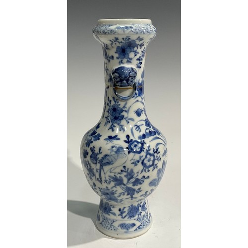 354 - A Chinese baluster vase, painted in tones of underglaze blue with birds, flowers and foliage, moulde... 