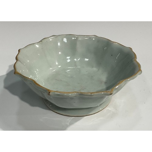 356 - A Chinese celadon lotus shaped dish, brown line to rim, 18cm diam, 19th century