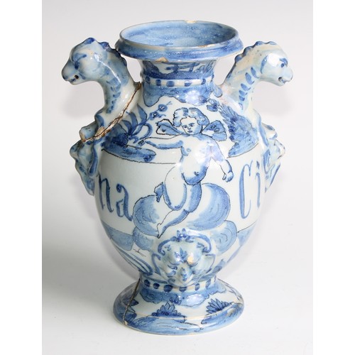 97 - A pair of Delft apothecary drug jars, each inscribed and painted in tones of blue with putti in a la... 