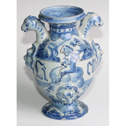 97 - A pair of Delft apothecary drug jars, each inscribed and painted in tones of blue with putti in a la... 