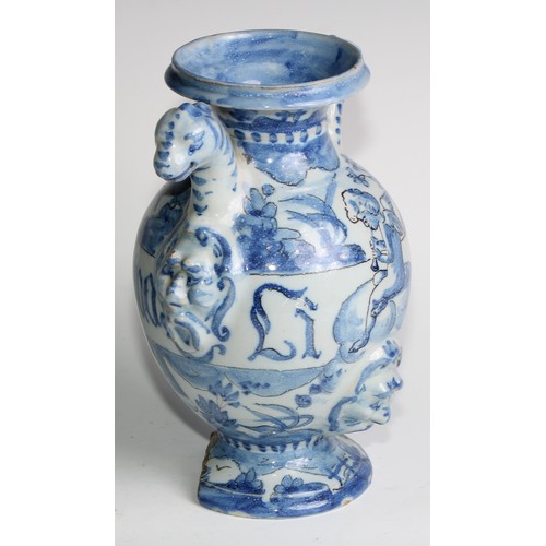 97 - A pair of Delft apothecary drug jars, each inscribed and painted in tones of blue with putti in a la... 