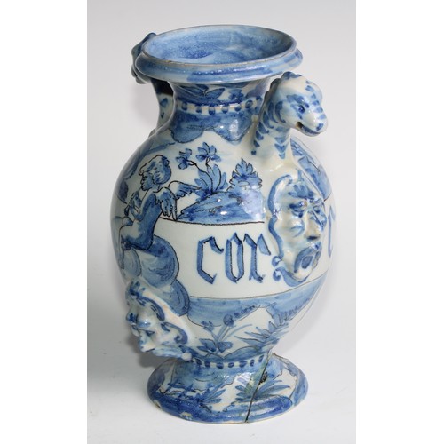 97 - A pair of Delft apothecary drug jars, each inscribed and painted in tones of blue with putti in a la... 