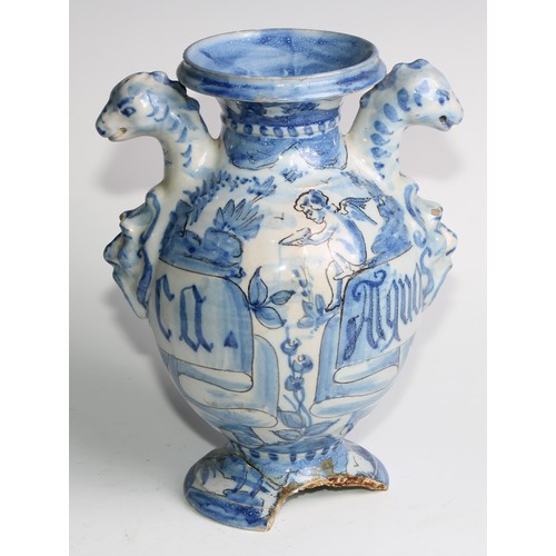 97 - A pair of Delft apothecary drug jars, each inscribed and painted in tones of blue with putti in a la... 