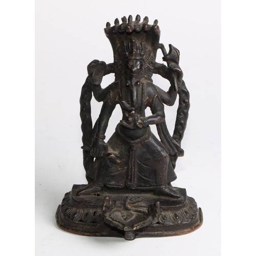 464 - Indian School (19th century), a dark patinated bronze shrine figure, of Ganesh, rounded rectangular ... 