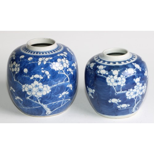 395 - A Chinese ovoid ginger jar, painted in tones of underglaze blue with blossoming prunus on a ground o... 