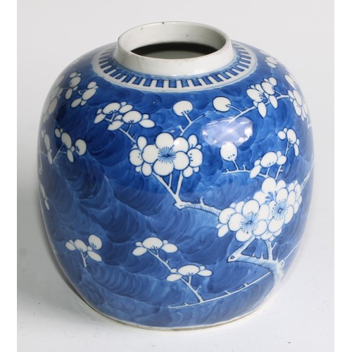 395 - A Chinese ovoid ginger jar, painted in tones of underglaze blue with blossoming prunus on a ground o... 