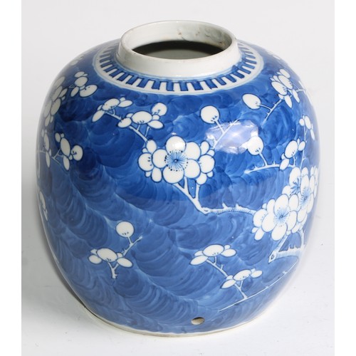 395 - A Chinese ovoid ginger jar, painted in tones of underglaze blue with blossoming prunus on a ground o... 