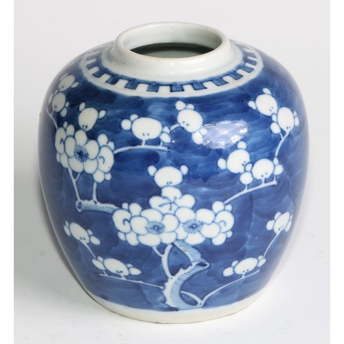 395 - A Chinese ovoid ginger jar, painted in tones of underglaze blue with blossoming prunus on a ground o... 