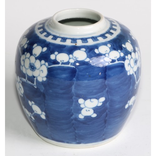 395 - A Chinese ovoid ginger jar, painted in tones of underglaze blue with blossoming prunus on a ground o... 