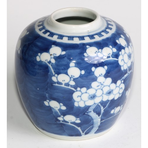 395 - A Chinese ovoid ginger jar, painted in tones of underglaze blue with blossoming prunus on a ground o... 