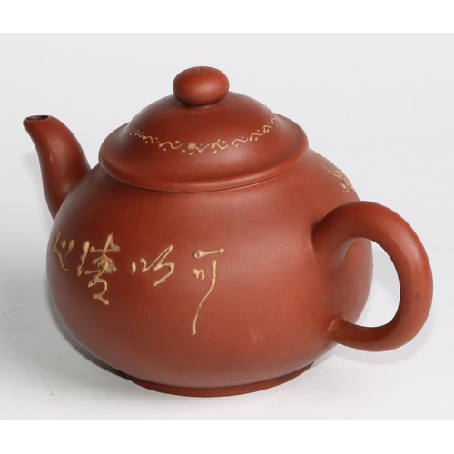 414 - A Chinese Yixing teapot, moulded with blossoming prunus, 15cm high, seal mark; others (4)