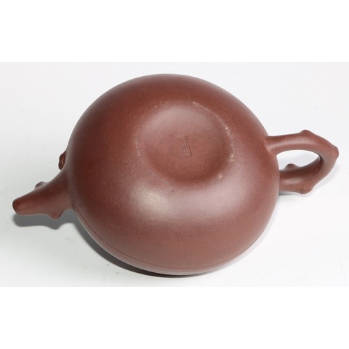 414 - A Chinese Yixing teapot, moulded with blossoming prunus, 15cm high, seal mark; others (4)