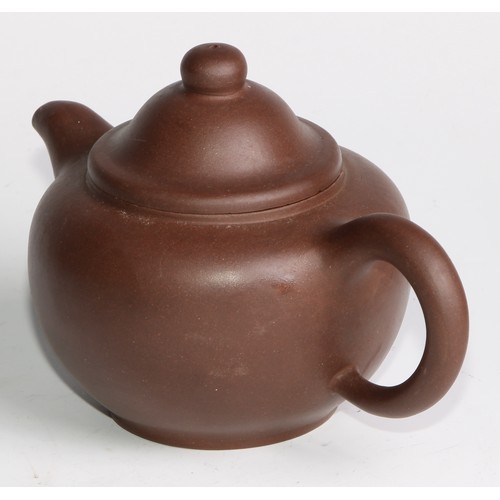 414 - A Chinese Yixing teapot, moulded with blossoming prunus, 15cm high, seal mark; others (4)