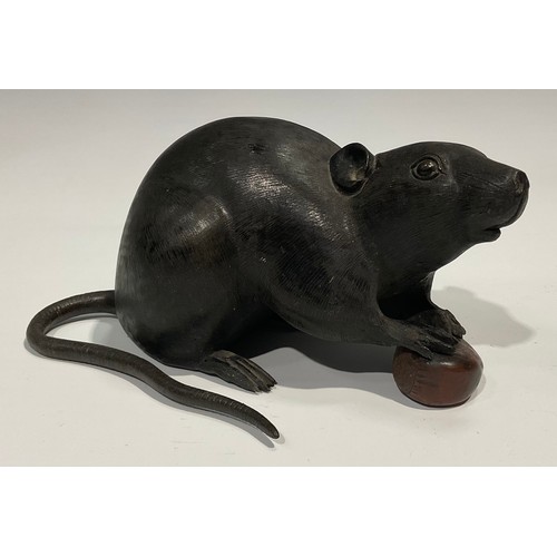 467 - Japanese School (Meiji period), a dark and brown patinated bronze, of a rat holding a chestnut, 19cm... 