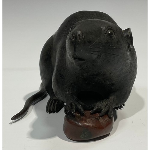 467 - Japanese School (Meiji period), a dark and brown patinated bronze, of a rat holding a chestnut, 19cm... 