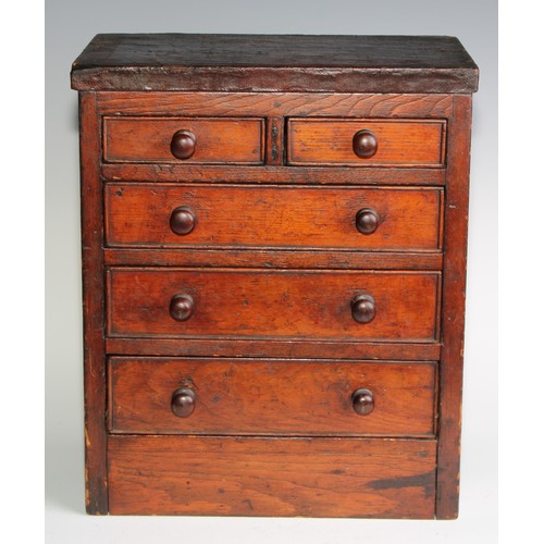 2073 - Miniature Furniture - a scratch built chest of two short and three long graduated drawers, the under... 