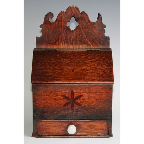 2472 - A George III oak salt or candle box, shaped cresting, hinged sloping cover above a drawer, inlaid wi... 