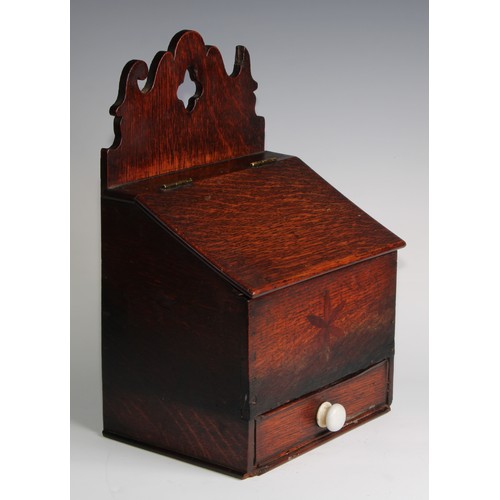 2472 - A George III oak salt or candle box, shaped cresting, hinged sloping cover above a drawer, inlaid wi... 