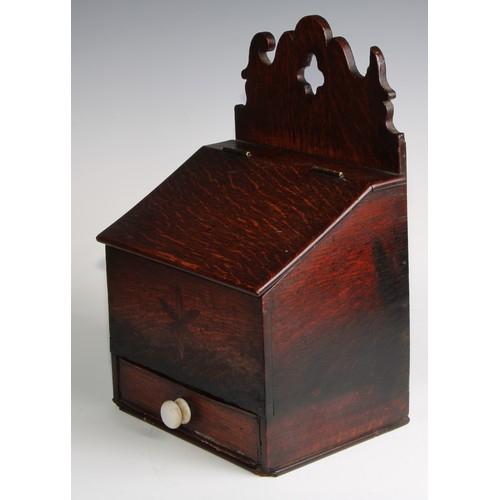 2472 - A George III oak salt or candle box, shaped cresting, hinged sloping cover above a drawer, inlaid wi... 