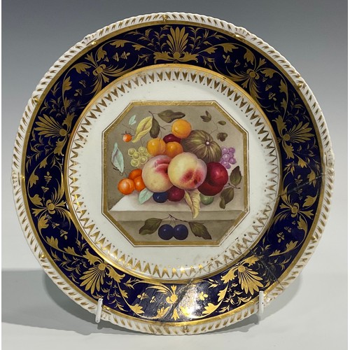 232 - A Derby circular plate, painted with ripening fruit, within an octagonal cartouche, the cobalt blue ... 