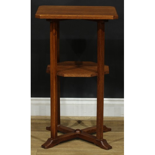 2655 - An Arts & Crafts oak occasional table, chamfered rectangular top, open undertier, X-form sledge base... 