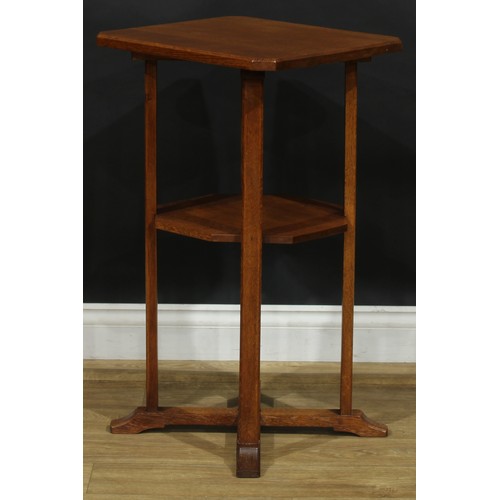 2655 - An Arts & Crafts oak occasional table, chamfered rectangular top, open undertier, X-form sledge base... 